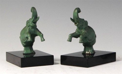 Lot 93 - A pair of Art Deco green patinated spelter...