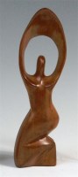 Lot 73 - A 1960s stylised teak carving of a kneeling...