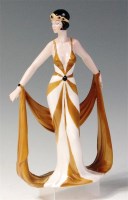 Lot 87 - An Art Nouveau style glazed porcelain figurine,...