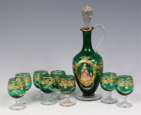 Lot 92 - An early 20th century green glass liquor set,...