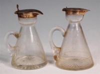 Lot 109 - Two Edwardian silver topped glass whisky tots,...