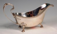 Lot 115 - A silver sauceboat, having a gadrooned rim and...