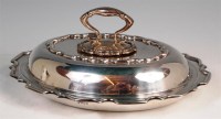Lot 116 - A silver lidded entree dish, of shaped oval...