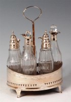 Lot 155 - A George III silver seven bottle cruet, of...