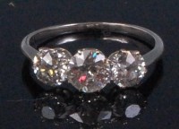 Lot 201 - A white metal ladies diamond three stone ring,...