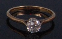 Lot 203 - An 18ct gold diamond solitaire ring, the claw...