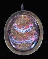 Lot 209 - A brass glazed reliquary locket, purportedly...