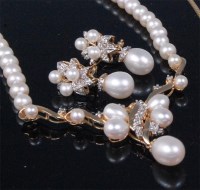 Lot 219 - A contemporary 14ct gold pearl and diamond set...