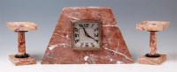 Lot 9 - An Art Deco marble matched three piece clock...
