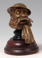 Lot 16 - A cast brass car mascot in the form of Bruce...
