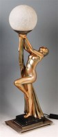 Lot 63 - An Art Deco period gilded plaster table lamp,...