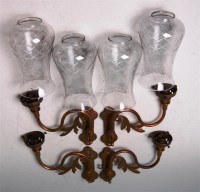 Lot 94 - A set of four Art Nouveau brass wall lights,...