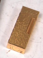 Lot 49 - A Dunhill gold plated pocket cigarette lighter,...