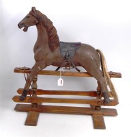 Lot 3103 - An Edwardian carved wood rocking horse of very...