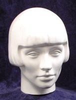 Lot 53 - A 1970s white glazed ceramic female portrait...