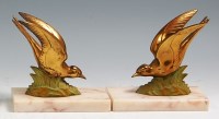 Lot 113 - A pair of Art Deco patinated spelter figures,...