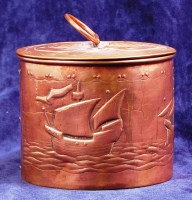 Lot 110 - A Newlyn school copper biscuit barrel and...