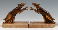 Lot 112 - A pair of Art Deco patinated spelter figures,...