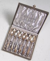 Lot 165 - A set of six cased silver teaspoons by Georg...