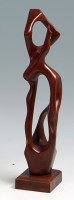 Lot 222 - A Henry Moore style teak carving of a...