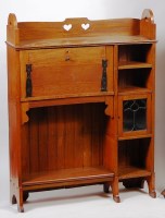 Lot 356 - An Art Nouveau oak students bureau, having a...