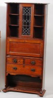Lot 357 - An Art Nouveau oak freestanding wall cupboard,...