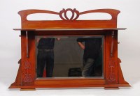 Lot 394 - An Art Nouveau walnut overmantel mirror, the...