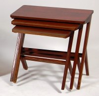 Lot 398 - A 1970s teak nest of three occasional tables,...