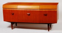 Lot 399 - A 1960s teak bowfront sideboard, having three...