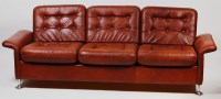 Lot 407 - A 1970s Danish brown leather three seater...