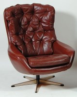 Lot 350 - A 1960s Danish brown leather swivel bucket...