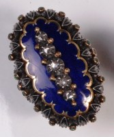 Lot 641 - An early 20th century yellow gold, blue enamel,...