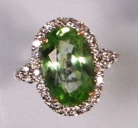 Lot 649 - A contemporary 18ct white gold, green peridot...