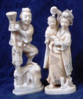 Lot 825 - A pair of Japanese Meiji period carved ivory...