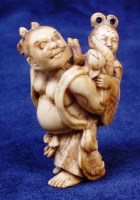 Lot 834 - A Japanese Meiji period carved ivory netsuke,...