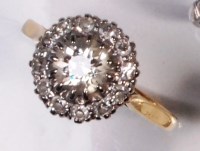 Lot 698 - An 18ct gold and platinum diamond cluster ring,...