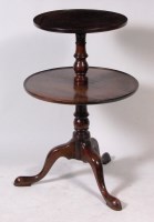 Lot 958 - A late Georgian mahogany two tier dumb waiter,...