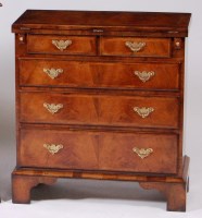 Lot 979 - A figured walnut bachelors chest, later...