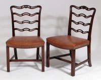 Lot 981 - A set of fifteen mahogany dining chairs, in...