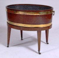 Lot 995 - A George III mahogany wine cooler, of oval...