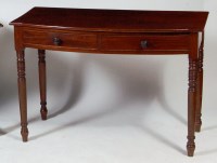 Lot 1002 - A Regency mahogany bowfront side table, having...