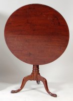 Lot 1008 - A George III oak tilt-top tripod table, having...