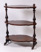 Lot 1021 - A Victorian figured walnut three tier whatnot,...