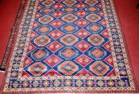 Lot 941 - A Kurdish woollen rug, the blue ground with...