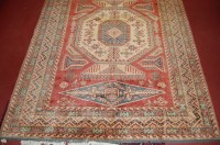 Lot 944 - A Persian Kazak woollen rug, having a complex...