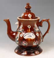 Lot 548 - A Victorian bargeware teapot on stand, the...