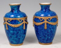 Lot 556 - A Paul Milet (1870-1950) pair of porcelain...