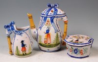 Lot 557 - A late 19th century French Quimper coffee pot...