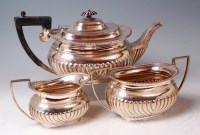 Lot 571 - An Edwardian silver three piece teaset,...