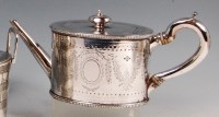 Lot 581 - A Victorian silver teapot, of beaded oval form...